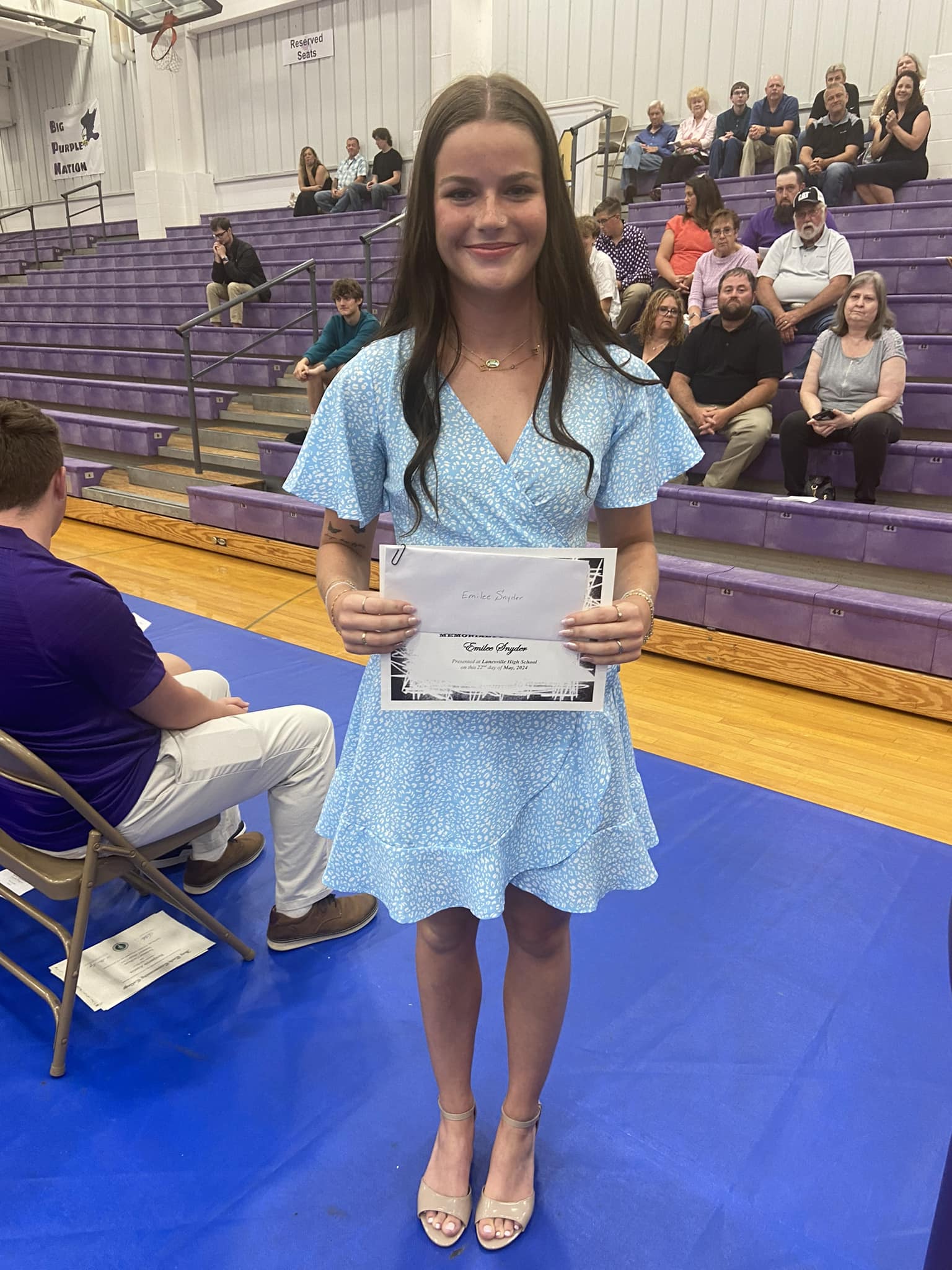 Lanesville student accepting scholarship.